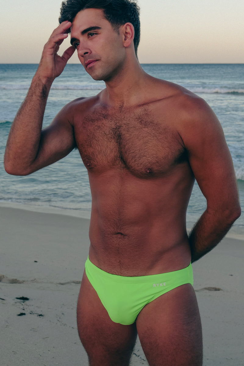 man in bright green swimwear